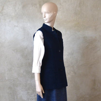 Buttoned side shot of Longer Length Ladies Waistcoat in Linton Tweeds Boucle. A pure cotton weave,  this is superbly trans-seasonal option. Handmade in London. 