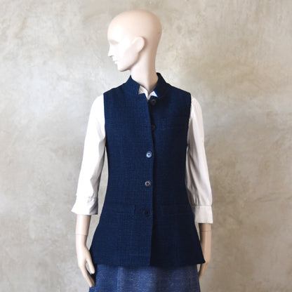 Half Buttoned front shot of Longer Length Ladies Waistcoat in Linton Tweeds Boucle. A pure cotton weave,  this is superbly trans-seasonal option. Handmade in London. 