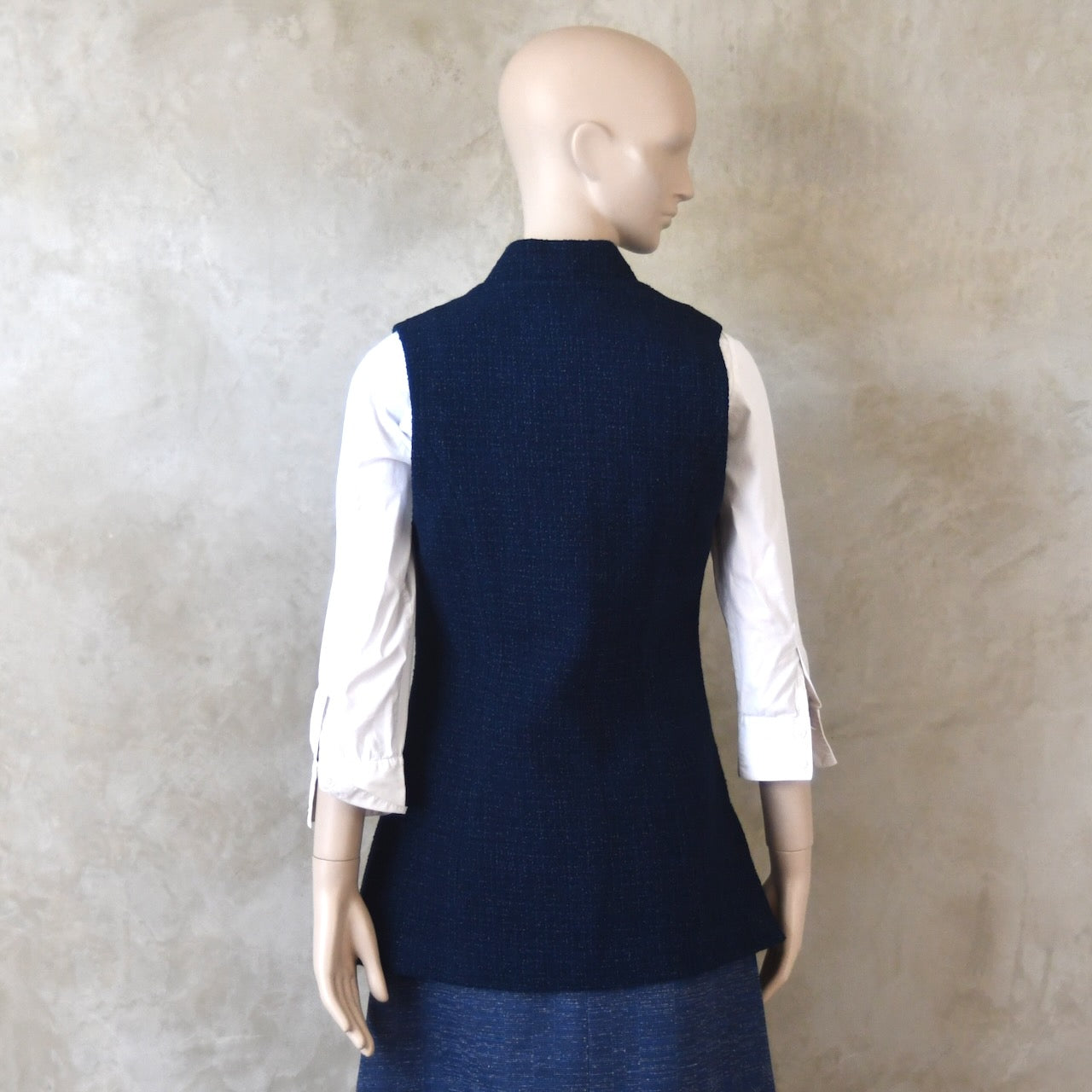 Back shot of Longer Length Ladies Waistcoat in Linton Tweeds Boucle. A pure cotton weave,  this is superbly trans-seasonal option. Handmade in London. 