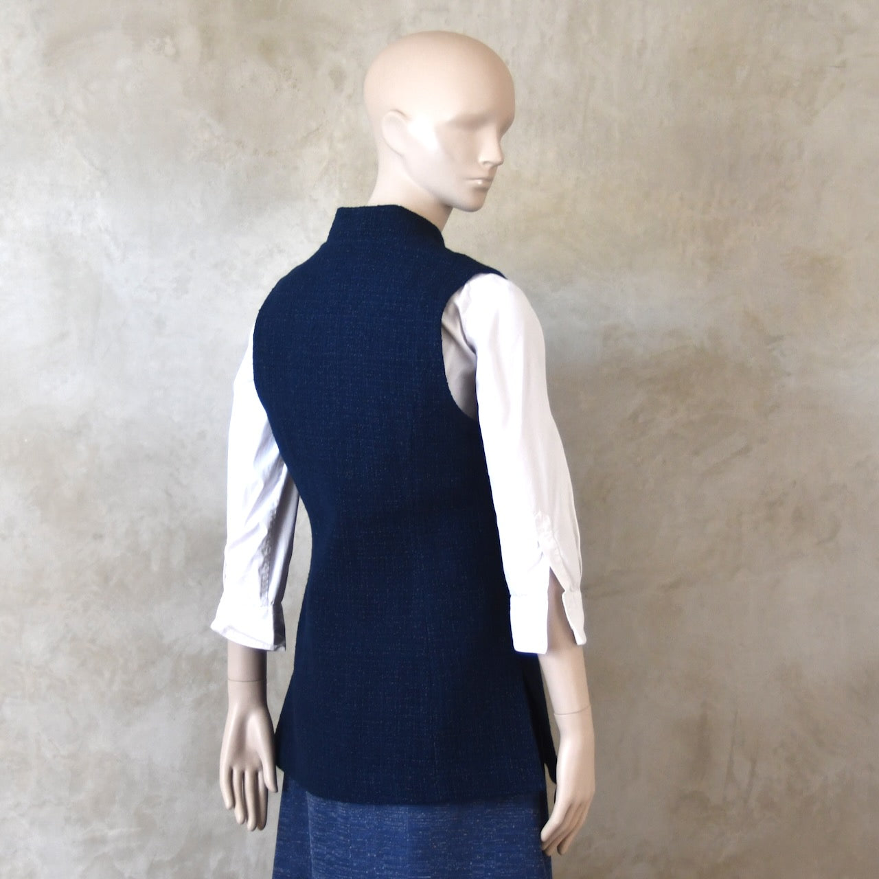 Back side shot of Longer Length Ladies Waistcoat in Linton Tweeds Boucle. A pure cotton weave,  this is superbly trans-seasonal option. Handmade in London. 