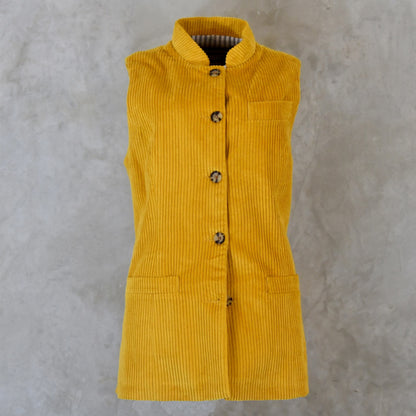 Front View of Ochre-Coloured Ladies Gilet. A pure cotton corduory ladies waistcoat with a longer length and waist shaping. Handmade in London.