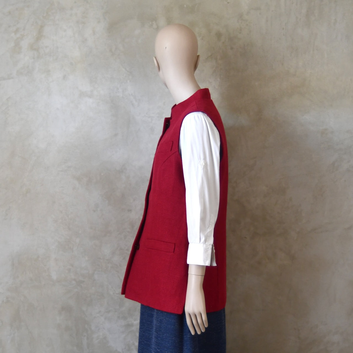 Side shot of Ladies Shaped Gilet in Red Irish linen. Handmade in London with a Nehru Collar and Cotton Ticking Lining.