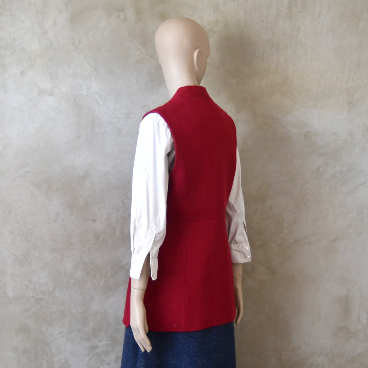 Back side shot of Ladies Shaped Gilet in Red Irish linen. Handmade in London with a Nehru Collar and Cotton Ticking Lining.