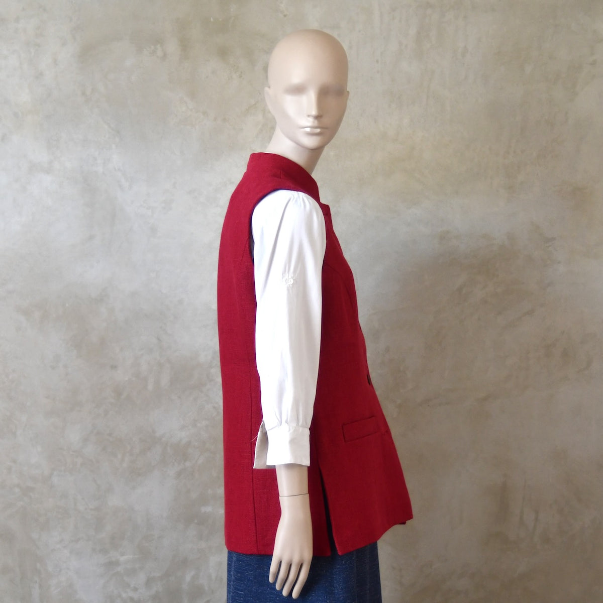 Side shot of Ladies Shaped Gilet in Red Irish linen. Handmade in London with a Nehru Collar and Cotton Ticking Lining.