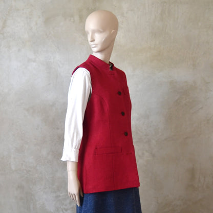 Angled Front Shot of Ladies Shaped Gilet in Red Irish linen. Handmade in London with a Nehru Collar and Cotton Ticking Lining.