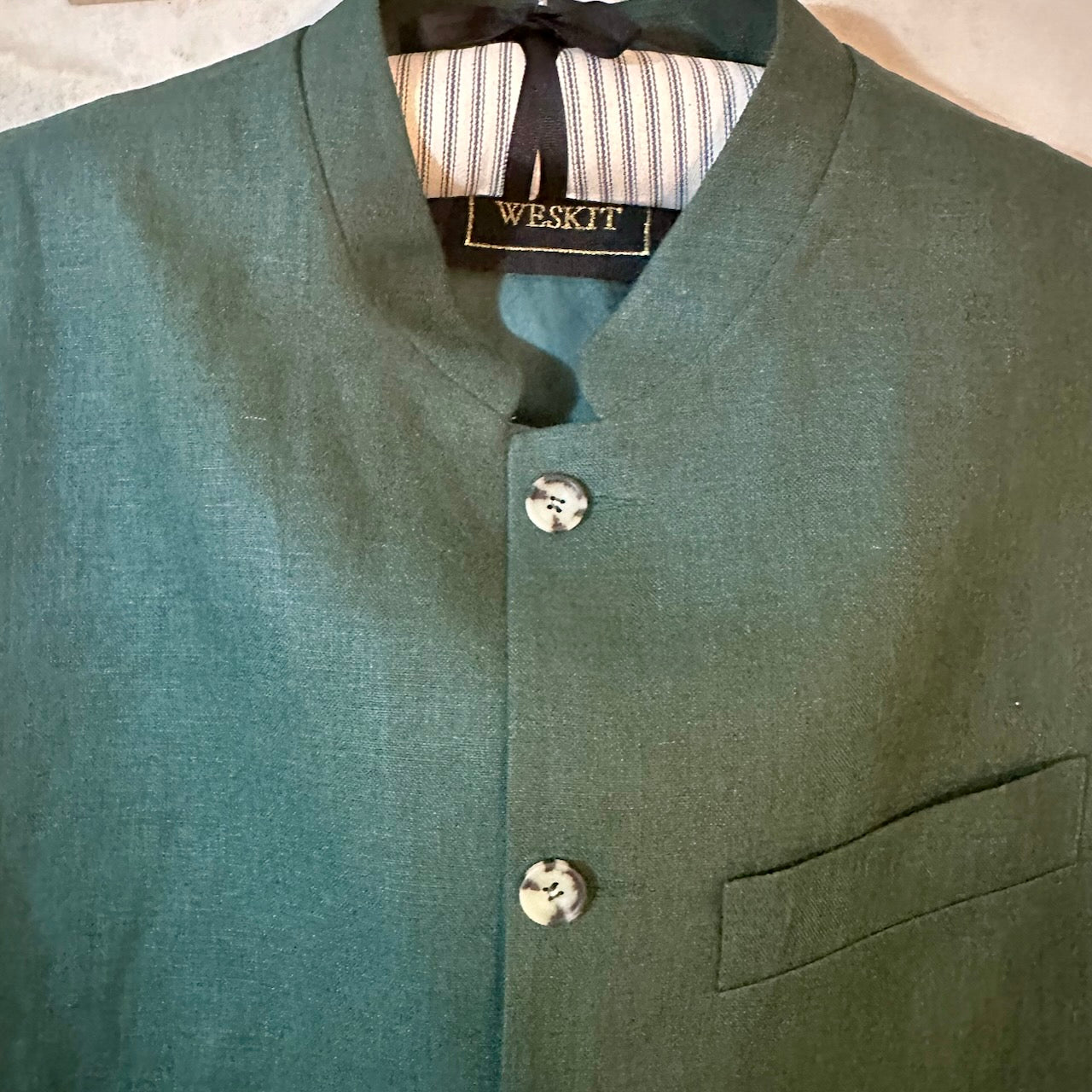Loose Cut Nehru-Style Gilet in Fine Gree Linen A superb alternative to a jacket with a neat cut and ample pocket space. Smart enough to go out in and relaxed enough for the every-day. 