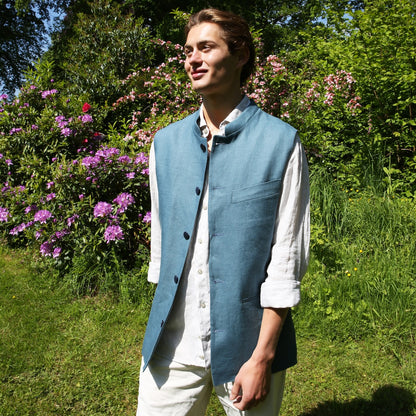 Blue Linen Nehru Style Gilet. Handmade in London this relaxed fit waistcoat has a mandarin collar, three outer and two inner pockets. Made from Irish Linen. Full View.