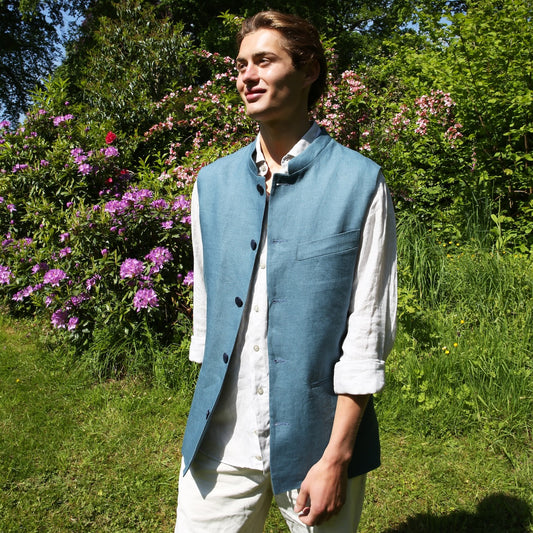 Blue Linen Nehru Style Gilet. Handmade in London this relaxed fit waistcoat has a mandarin collar, three outer and two inner pockets. Made from Irish Linen. Full View.