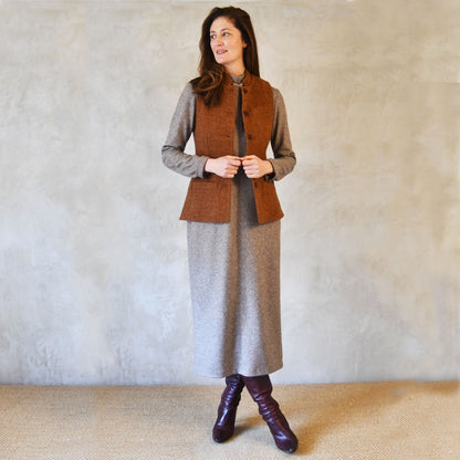 Ladies Gilet in Russet Lovat Tweed.  A Tailored Fit waistcoat with a Nehru Collar and natural corozo buttons. Handmade in Britain. Worn open over jumper dress.