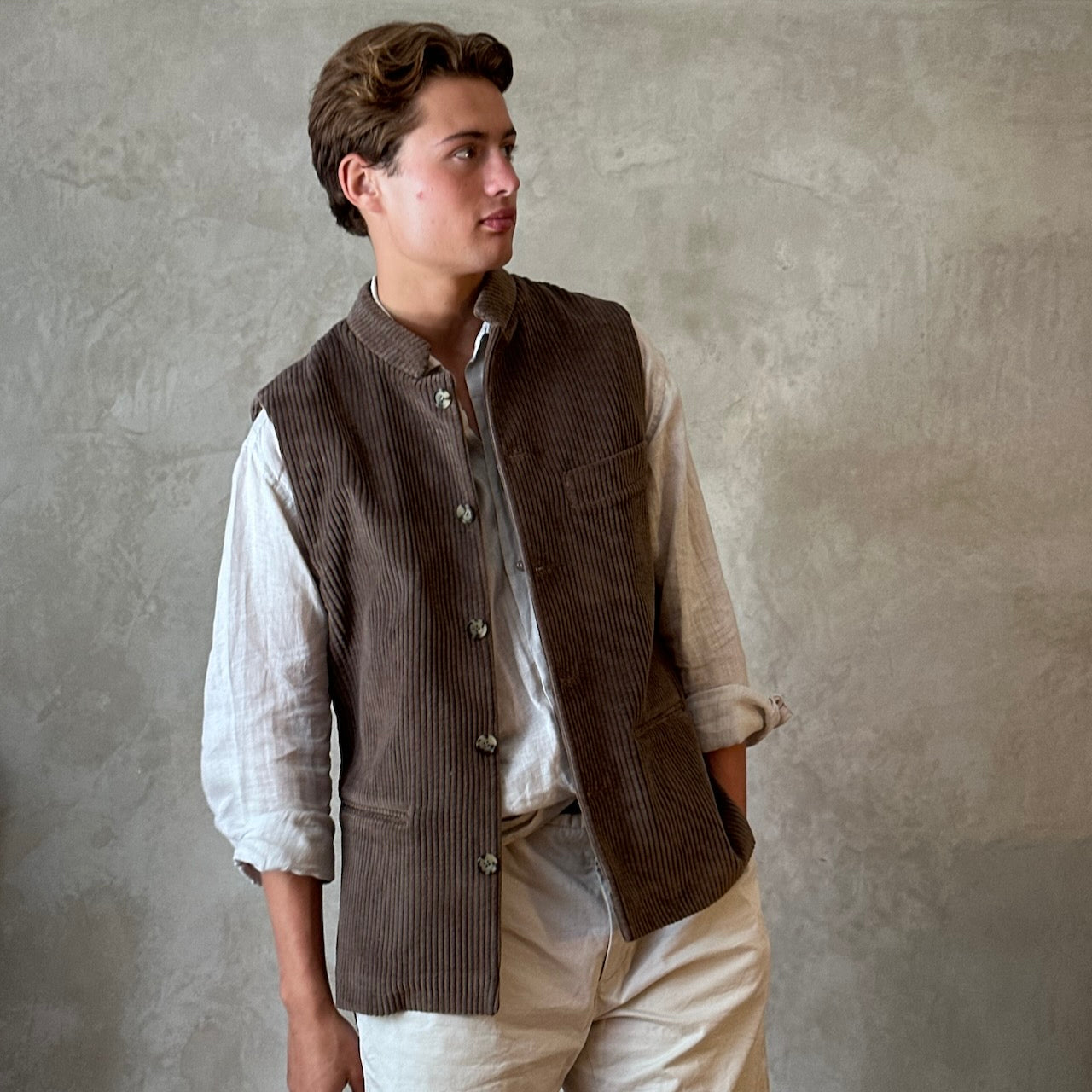 Light Brown Nehru-Style Slim Cut Gilet. This fitted waistcoat has a pure cotton cord outer and pure cotton ticking lining. Handmade in London it is the prefect alternative to a jacket or jumper in the cooler seasons. Relaxed View.