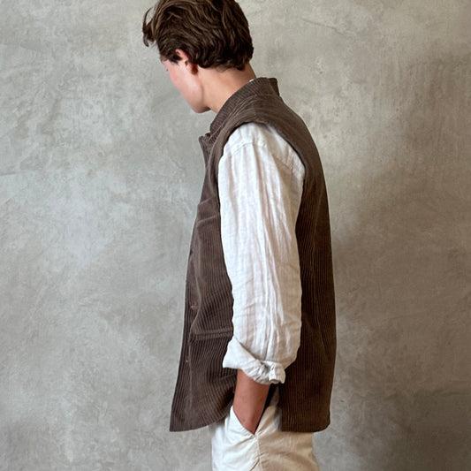 Light Brown Nehru-Style Slim Cut Gilet. This fitted waistcoat has a pure cotton cord outer and pure cotton ticking lining. Handmade in London it is the prefect alternative to a jacket or jumper in the cooler seasons. Side Rear View.