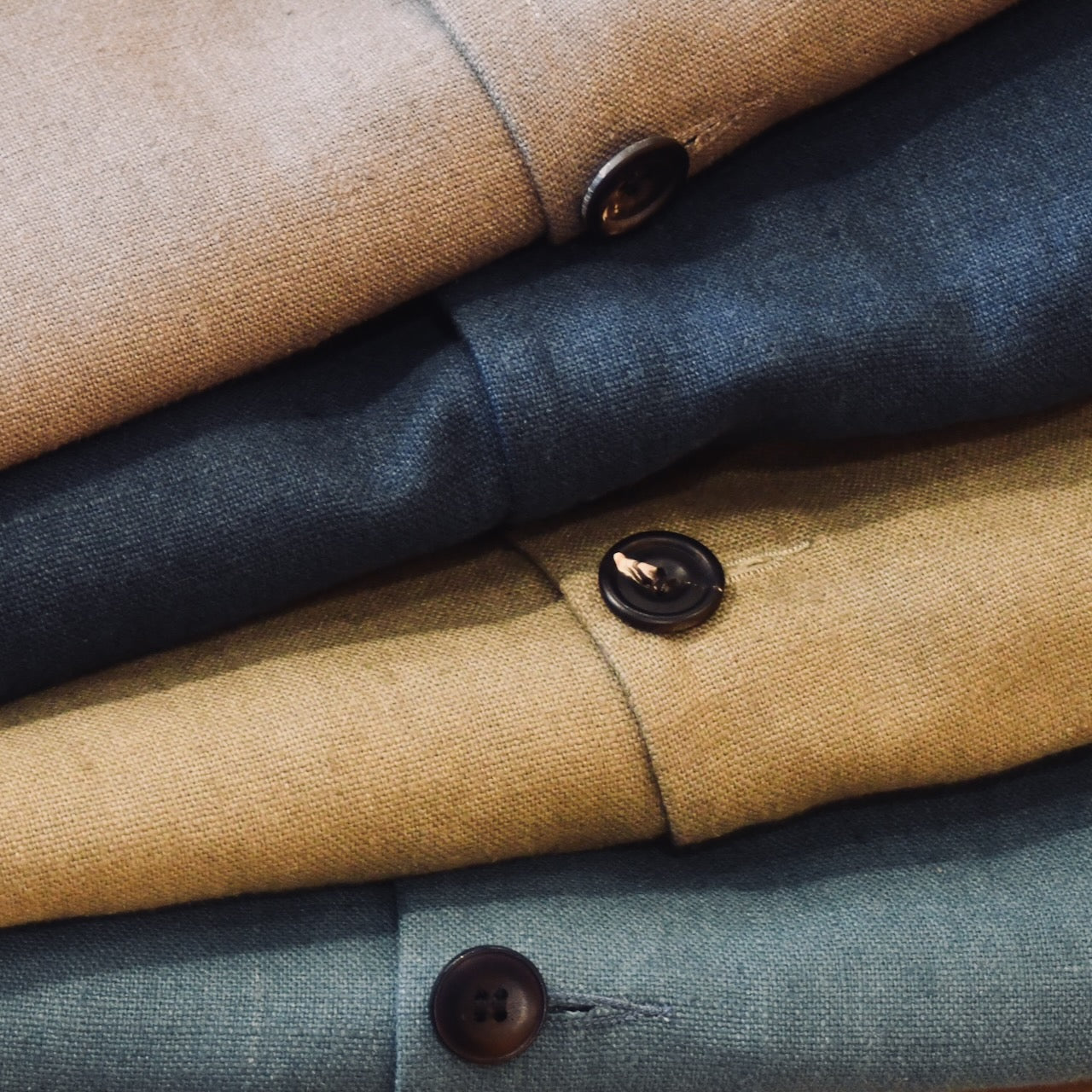 Mid Weight Slubby Irish Linens from Baird McNutt for Weskit Gilets and Waistcoats. Handmade in London. Shot showing Fossil, Indigo Navy, Khaki and Sea Blue Midtweight Linen Gilets.