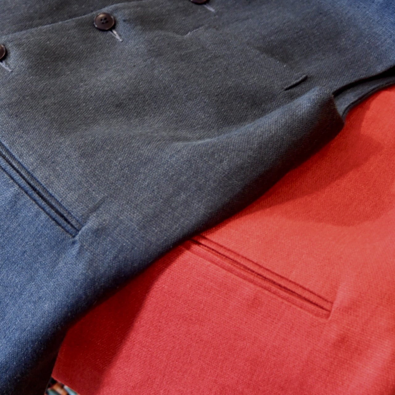 Heavy Weight Irish Linens from Baird McNutt for Weskit Gilets and Waistcoats. Handmade in London. Shot showing Indigo Navy and Deep Red Heavy Weight Linen Gilets.