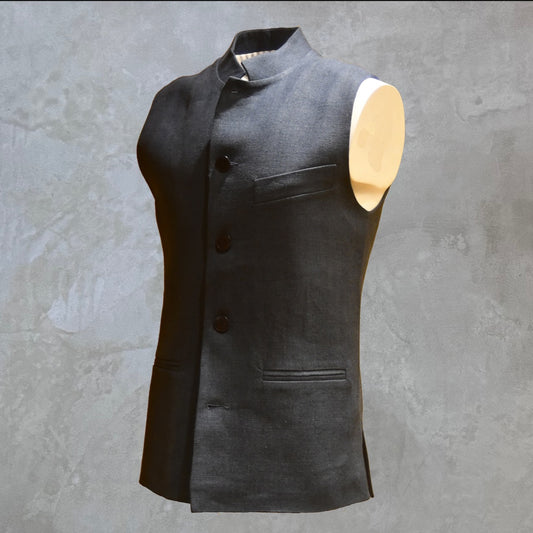 Loose cut Nehru Style Gilet in Deep Navy Linen. This handmade gilet is made from a relaxed mid weight Irish linen. With e Nehru collar detail, three external pockets and a five-buttoned front it is smart enough for work - and yet perfect for the weekend. Side Front Shot.