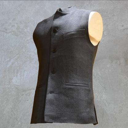 Loose cut Nehru Style Gilet in Deep Navy Linen. This handmade gilet is made from a relaxed mid weight Irish linen. With e Nehru collar detail, three external pockets and a five-buttoned front it is smart enough for work - and yet perfect for the weekend. Side Front Shot.
