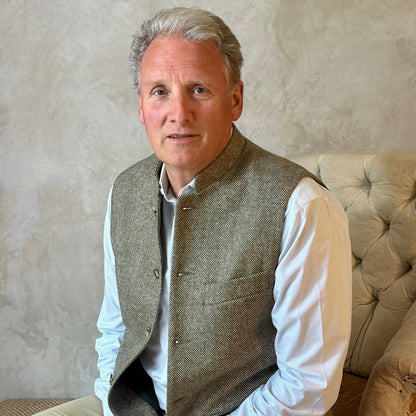 Nehru Style Gilet in a Hopsack patterning that gives the overall effect of a misty green. With a weight that will take you from early autumn through until late Spring, this smart tweed will quickly pay its way.
Lined in Cotton Ticking this waistcoat has Flat Horn buttons and a Mandarin collar.
A superb alternative to a jacket or jumper for the cooler days and nights with a slim, tailored cut and ample pocket space. Warm and easy to wear, it will work as well inside 