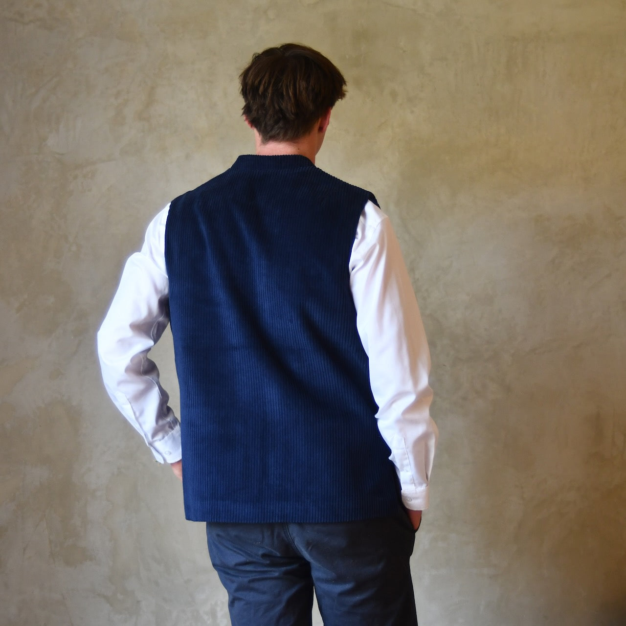 Rear View of Navy Cotton Corduroy Loose Cut Gilet. Handmade in London.