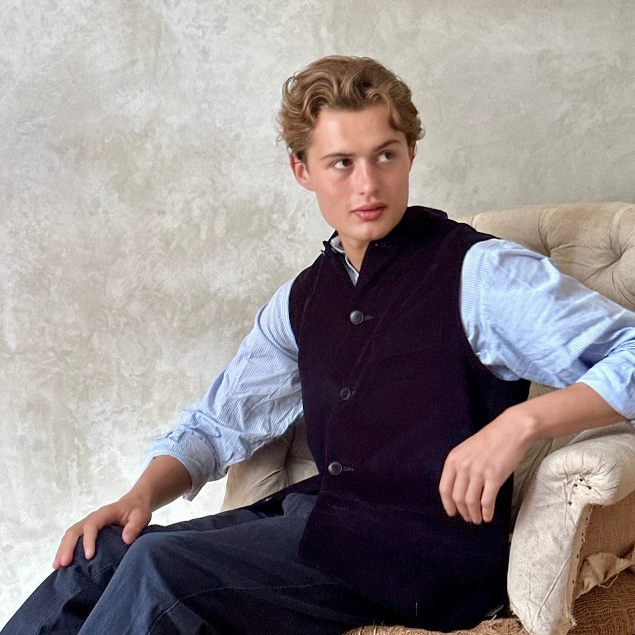 Slim Cut Nehru Style Gilet in Navy Velvet. This pure cotton velvet waistcoat is lined in pure cotton striped ticking. Handmade in London the gilet has three outer and two inner pockets. a Nehru collar and Blue Corozo Buttons. Perfect for a swell night out.