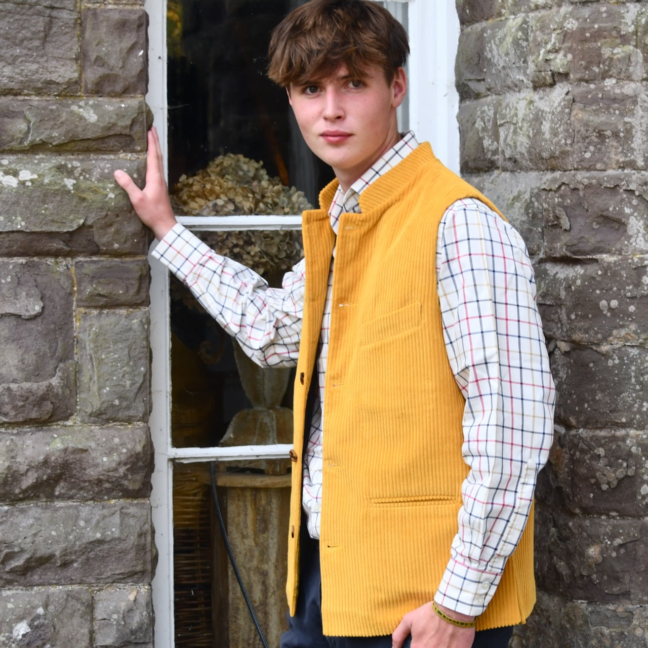 Nehru Style Gilet in Ochre Cotton Corduroy. This loose fit waistcoat is handmade in London. Side Unbuttoned Shot