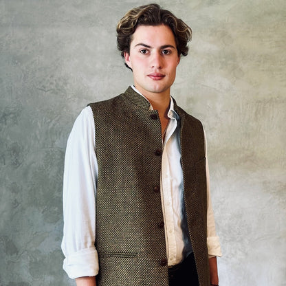 A Stunning patterned tweed Nehru-stle gilet, perfect for the city or country. this finely oven Yorkshire Tweed has a rich orange, green and brown patterning – subtle and very very smart. Handmade in London.