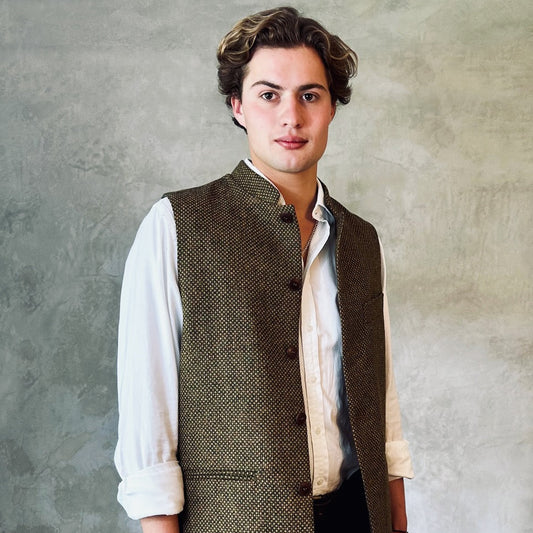 A Stunning patterned tweed Nehru-stle gilet, perfect for the city or country. this finely oven Yorkshire Tweed has a rich orange, green and brown patterning – subtle and very very smart. Handmade in London.