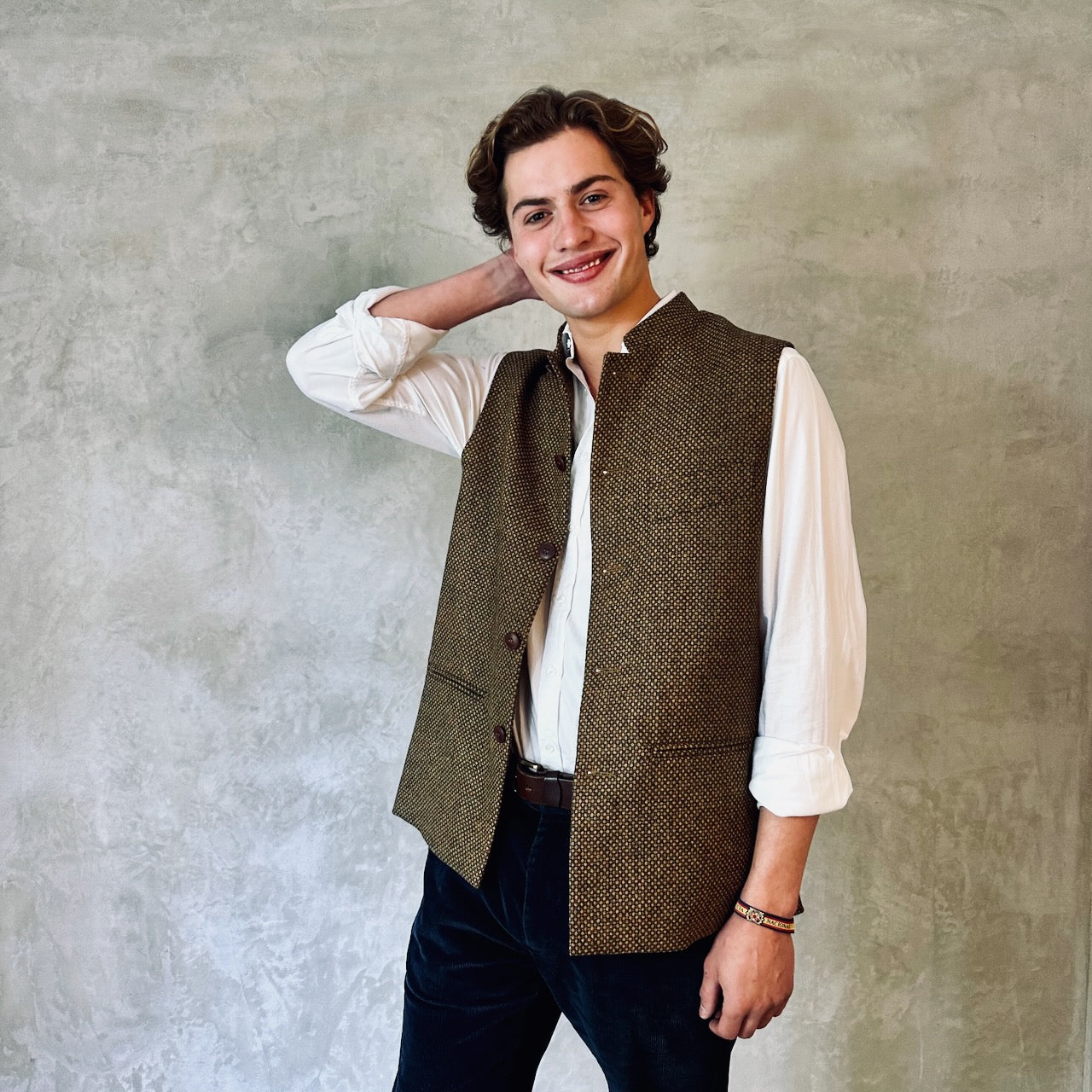 A Stunning patterned tweed Nehru-stle gilet, perfect for the city or country. this finely oven Yorkshire Tweed has a rich orange, green and brown patterning – subtle and very very smart. Handmade in London. Loose Fit.
