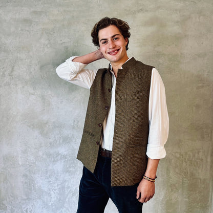 A Stunning patterned tweed Nehru-stle gilet, perfect for the city or country. this finely oven Yorkshire Tweed has a rich orange, green and brown patterning – subtle and very very smart. Handmade in London. Loose Fit.