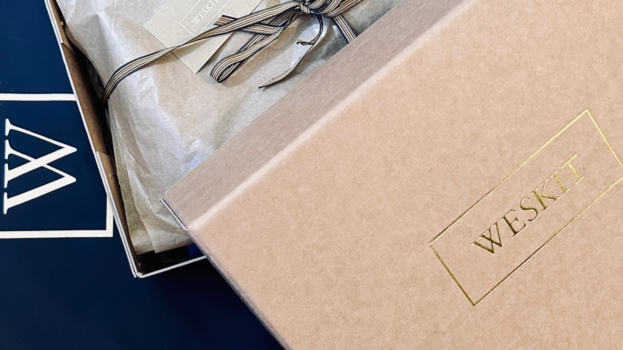 Handmade Stapled Compostable Boxes, Made in London for Weskit. Suit covers by Concept Covers.