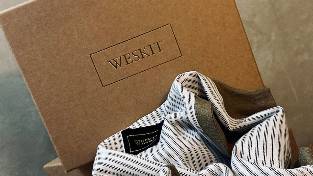 Handmade Stapled Compostable Boxes, Made in London for Weskit. Striped Cotton Ticking Lining and Embroidered Silk Label shown on Weskit Gilet.