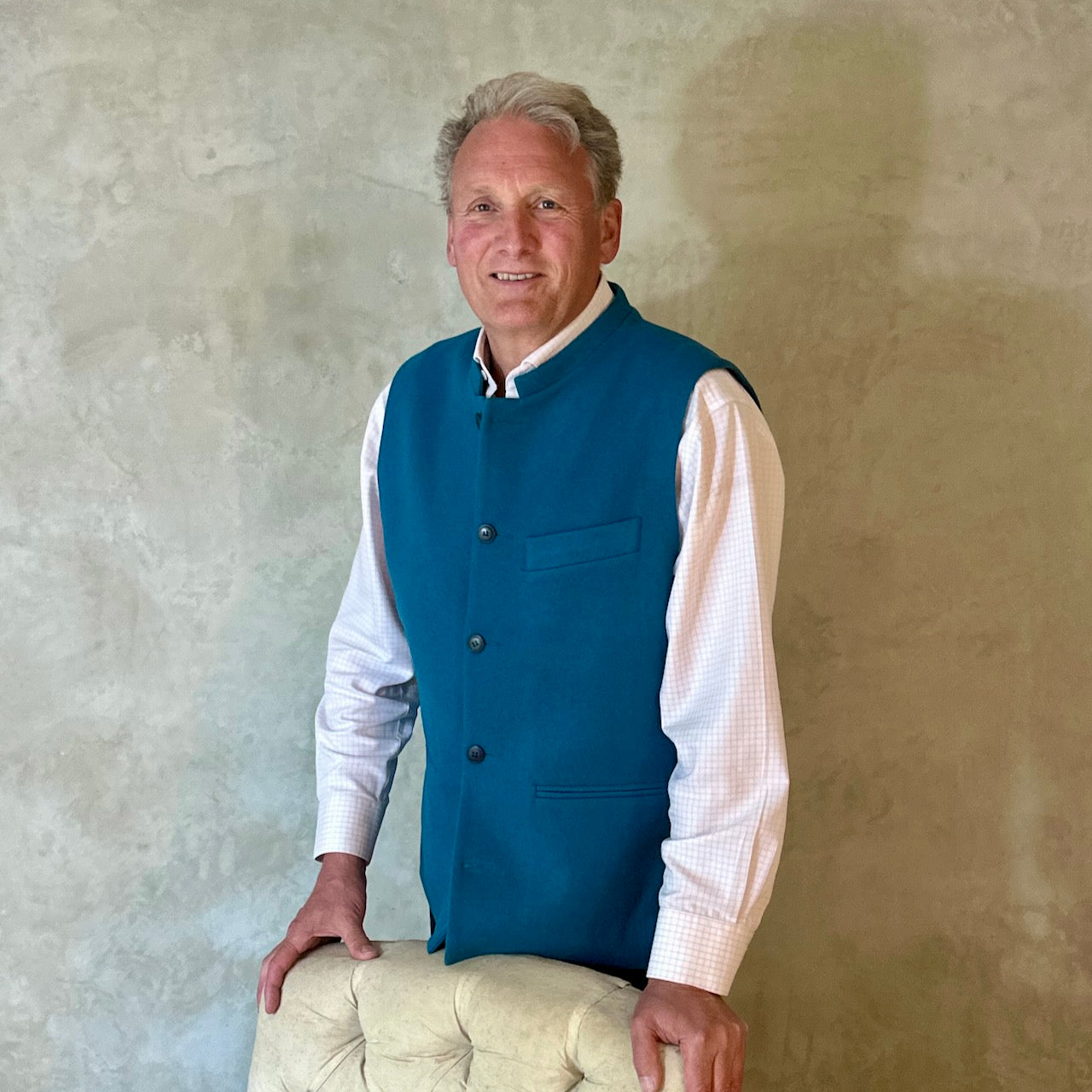 A superb and wonderfully warm alternative to a jacket for autumn winter in a luxurious pure merino wool flannel with a neat cut and ample pocket space. Woven in Yorkshire. Handmade in London. Buttons from Courtney & Co in Gloucestershire. Standing Shot.