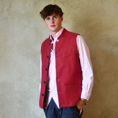 Red Linen Nehru-Style Fitted Waistcoat. Handmade in London. Bespoke and ready to ship. Shown unbuttoned over a pink shirt.