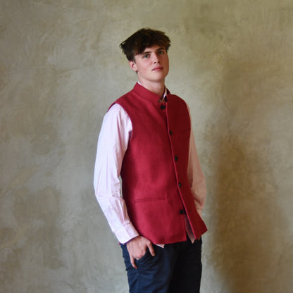 Red Linen Nehru-Style Fitted Waistcoat. Handmade in London. Bespoke and ready to ship. Shown buttoned over a pink shirt.