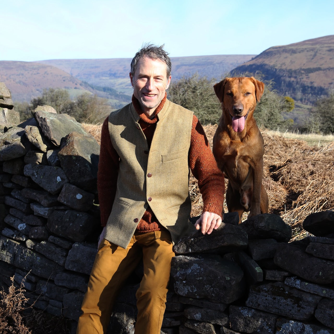 Bespoke Green Herringbone Tweed Gilet modelled in Wales. Hand made in London.
