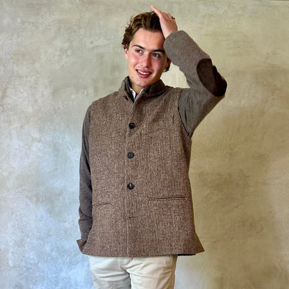 A wonderfully warm Nehru-style gilet in a thick tweed from Hawick. Designed in Wales, oven in England, handmade in London with buttons from Gloucestershire, this is a truly British Waistcoat. Detail Shot.