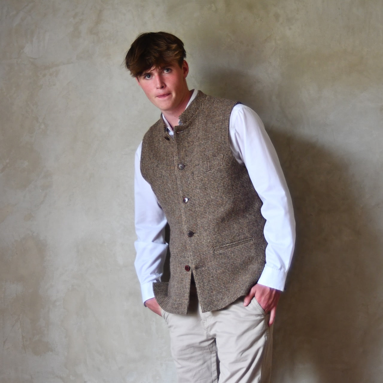 Bespoke Nehru Style Gilet in Brown Patterned Pure Wool Tweed. This tweed from Lovat Mill has a delicate patterning. Shown over a white shirt with Chinos.