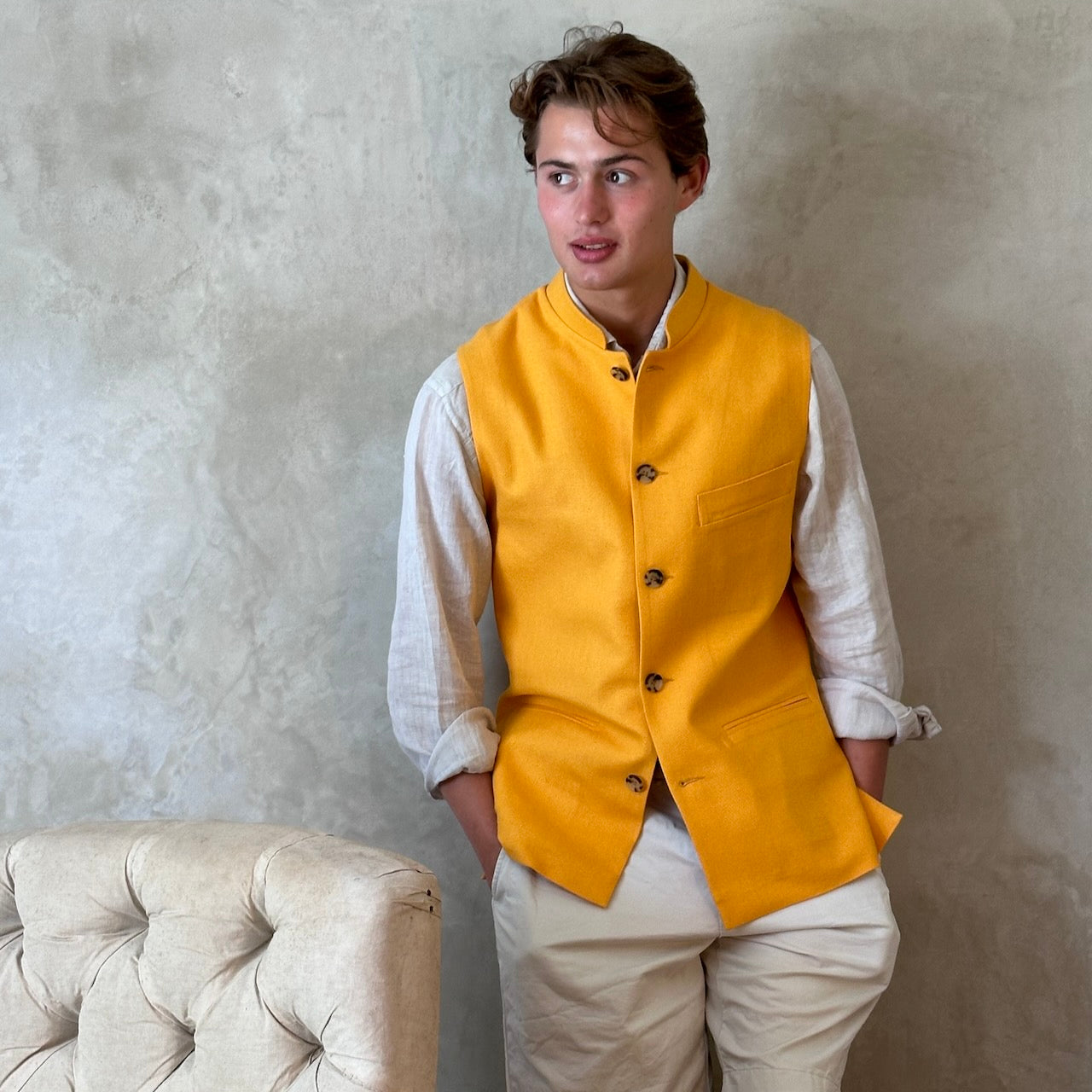 Summer weight slim-fit gilet in bright yellow silk weave. Handmade in London this tailored cut waistcoat has a Mandarin Collar, Striped Cotton Ticking Lining and five buttons to the front. Made in Great Britain.