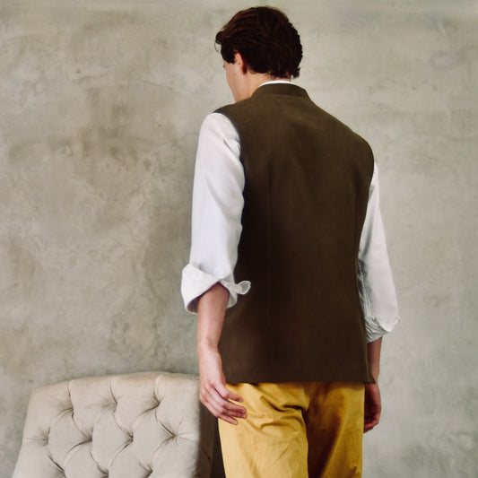 Slim Cut Nehru Style Gilet in Khaki Moleskin. This pure cotton gilet is lined in striped cotton Ticking. With a Nehru collar and five pockets it will take you everywhere and keep you warm on cooler days. Made by Hand in London. Rear View.
