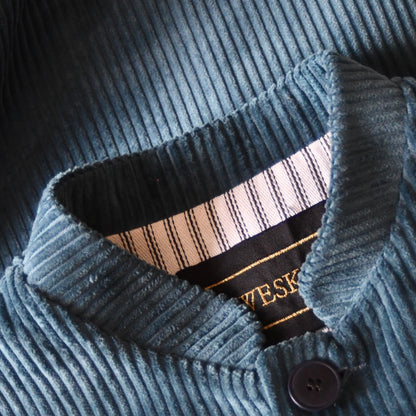 Detail Collar shot of Loose Fit Nehru Style Gilet in Teal Corduroy. This Bespoke pure cotton corduroy waistcoat is handmade in London. Shot shows mandarin collar on Weskit waistcoat.