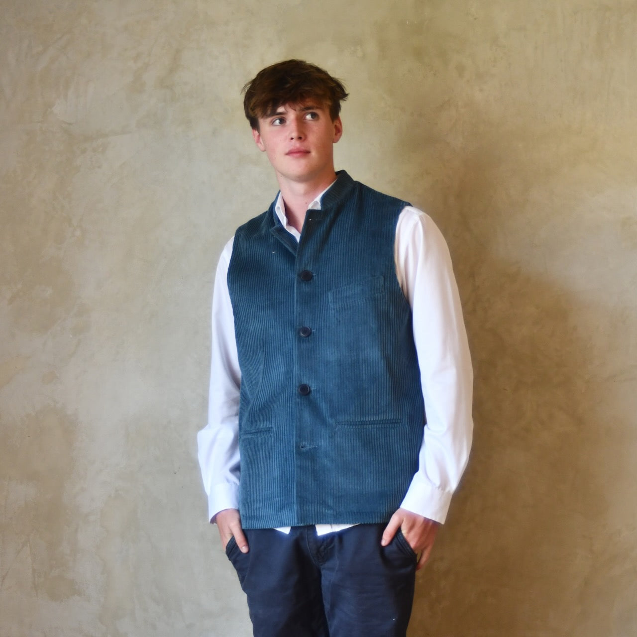 Fitted Cut Gilet in Teal Coloured Pure Cotton Corduroy. Handmade in London this Bespoke waistcoat can be ordered with a range of linings and collar types.