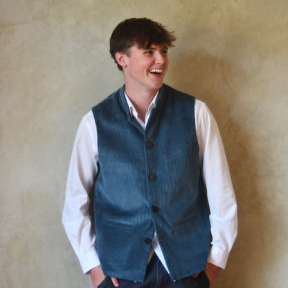 Slim Cut Gilet in Teal Coloured Pure Cotton Corduroy. Handmade in London this Bespoke waistcoat can be ordered with a range of linings and collar types.