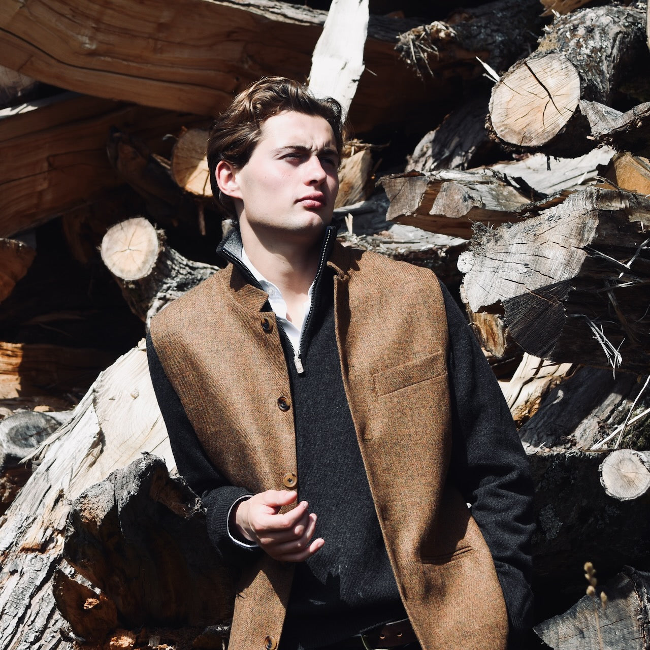 Bespoke Orange Herringbone Tweed Gilet modelled in Wales. Hand made in London.